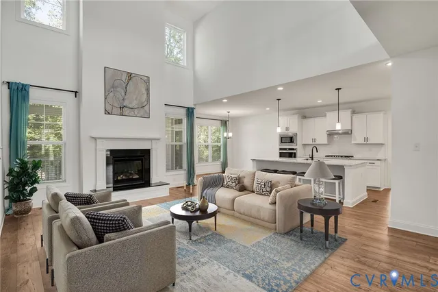 a view of kitchen with kitchen island wooden floor center island and appliances