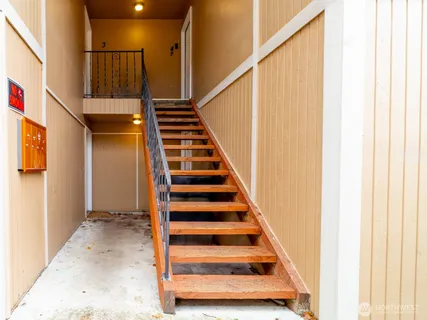 a kitchen with a refrigerator and cabinets