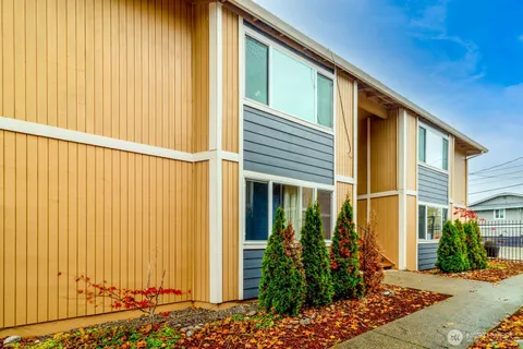 a kitchen with a refrigerator and a stove