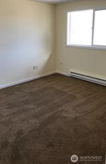 a front view of a house with a large window