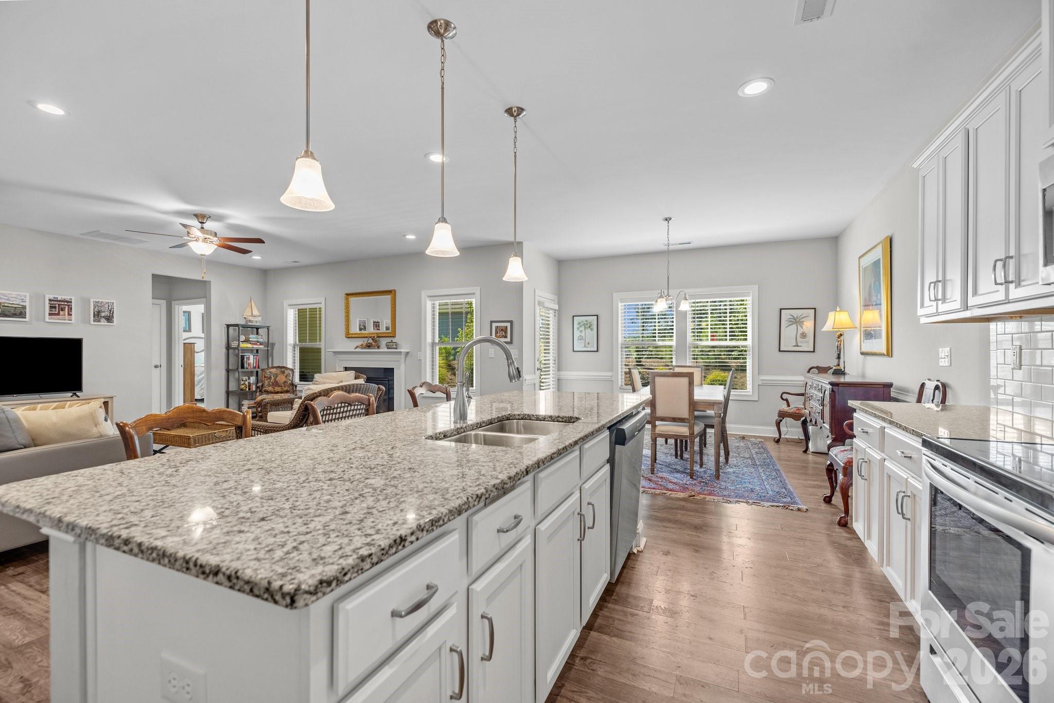 4697 Rinaldo Road York, SC 29745 - Photo 12 of 37 a large kitchen with kitchen island a large counter top and stainless steel appliances