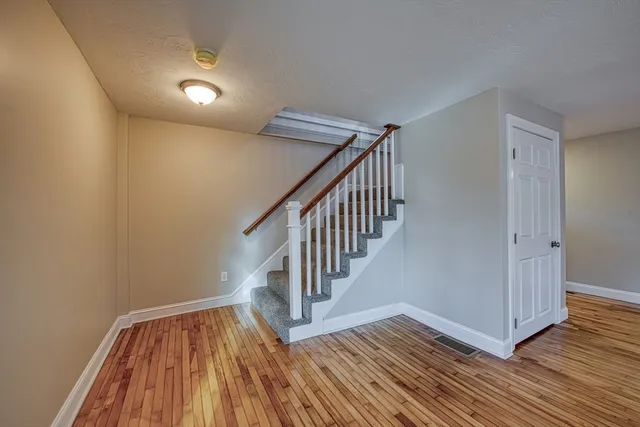 a view of entryway with wooden floor
