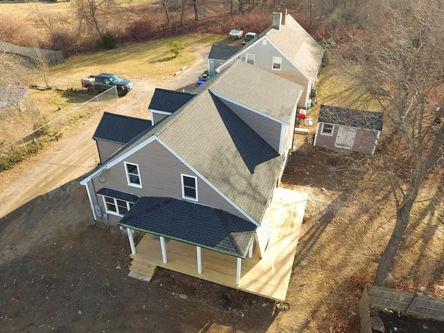 an aerial view of a house with swimming pool