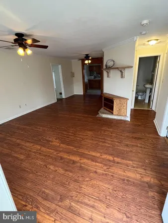 a view of a livingroom with wooden floor