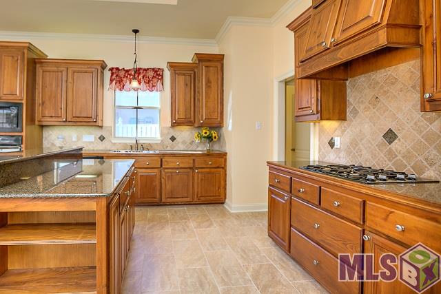 9304 Homestead Drive Baton Rouge, LA 70817 - Photo 11 of 30 Gas Range with exchaust fan - Granite slab island