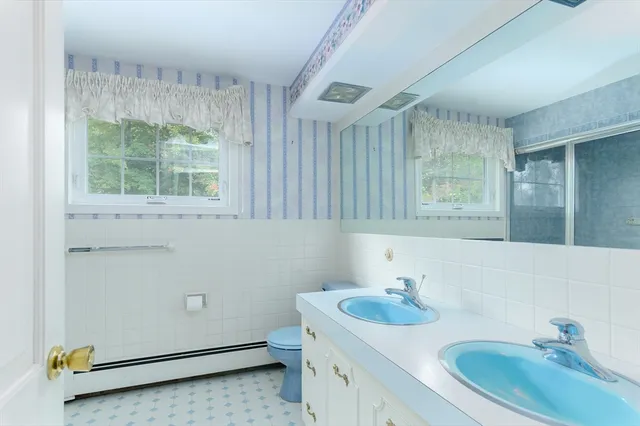 a bathroom with a sink and a washing machine