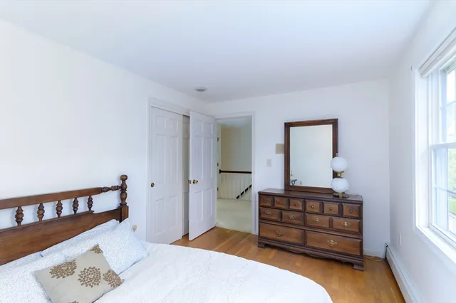 a bedroom with a bed and a window in it