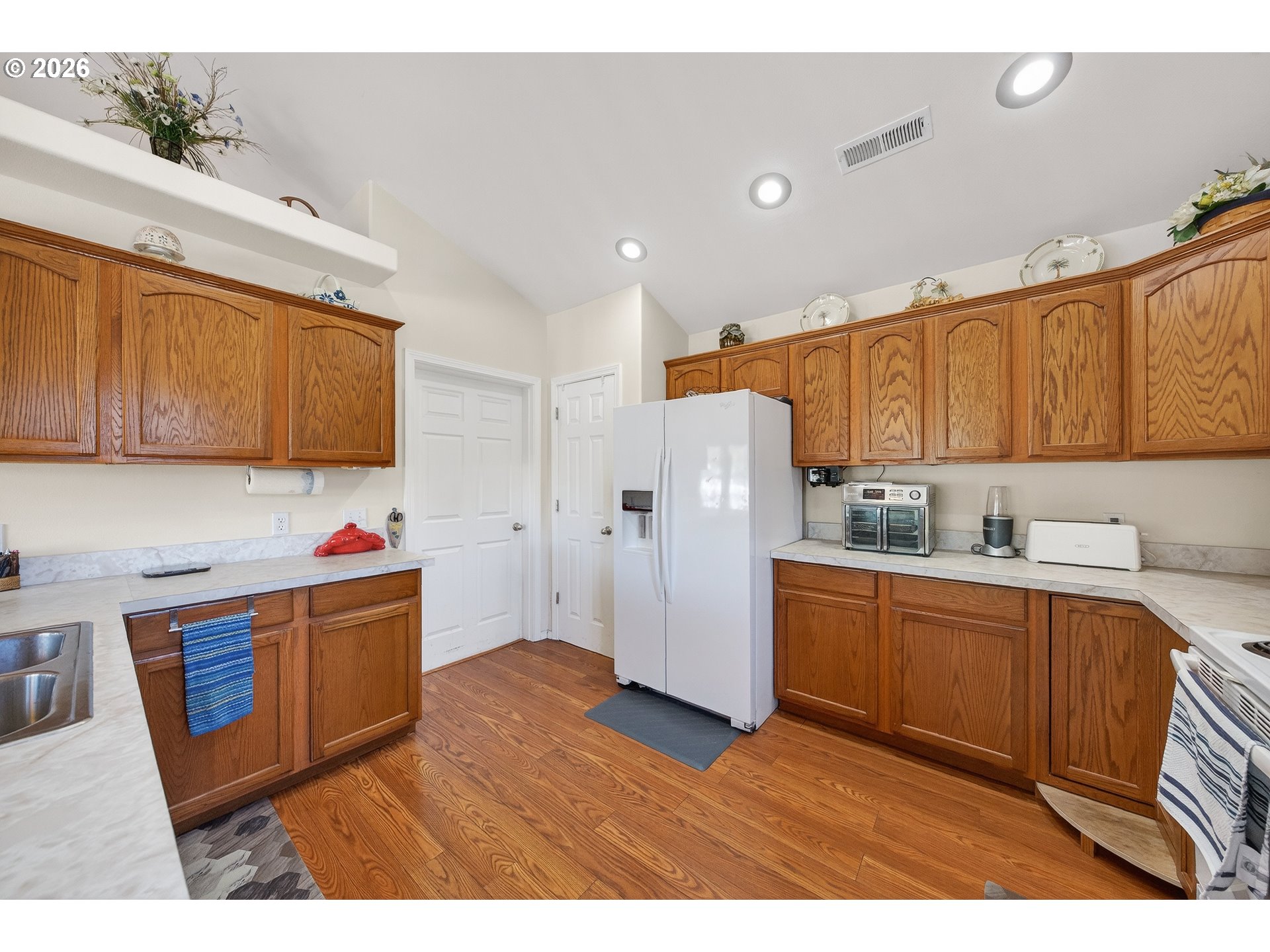 101 Pleasant Street Roseburg, OR 97470 - Photo 12 of 43 a kitchen view with wooden floor and cabinets