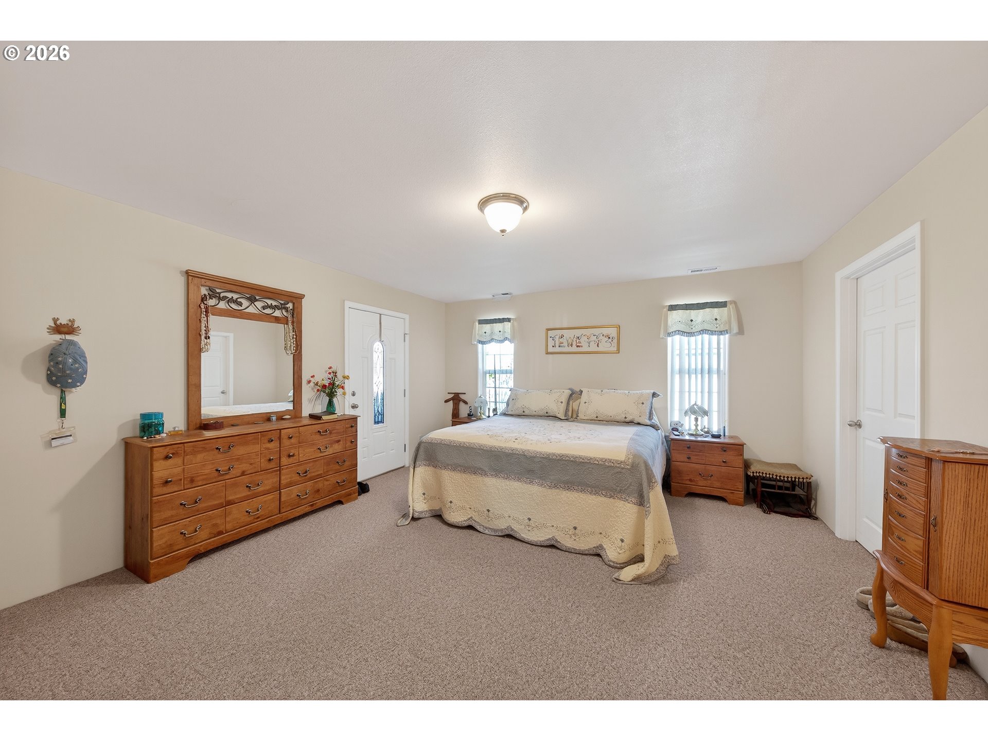 101 Pleasant Street Roseburg, OR 97470 - Photo 15 of 43 a spacious bedroom with a bed and furniture