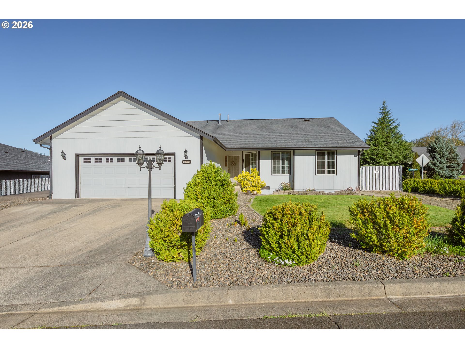 101 Pleasant Street Roseburg, OR 97470 - Photo 2 of 43 a front view of a house with garden