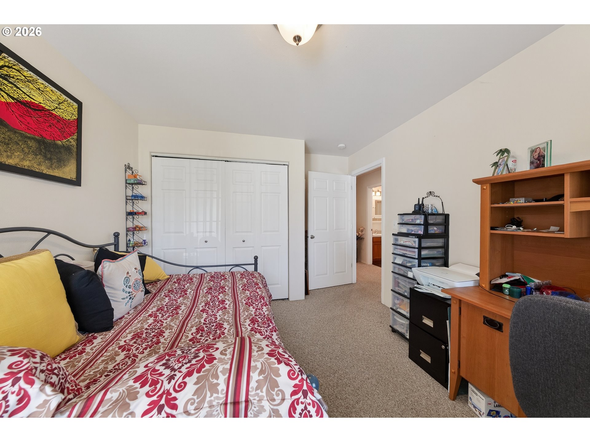 101 Pleasant Street Roseburg, OR 97470 - Photo 23 of 43 a bedroom with a bed and a book shelf