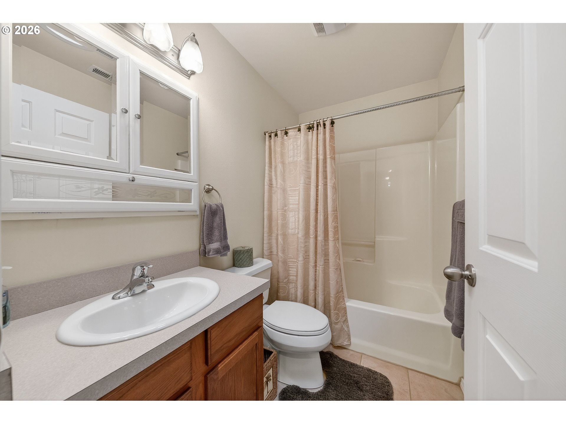 101 Pleasant Street Roseburg, OR 97470 - Photo 24 of 43 a bathroom with a sink toilet a mirror and shower