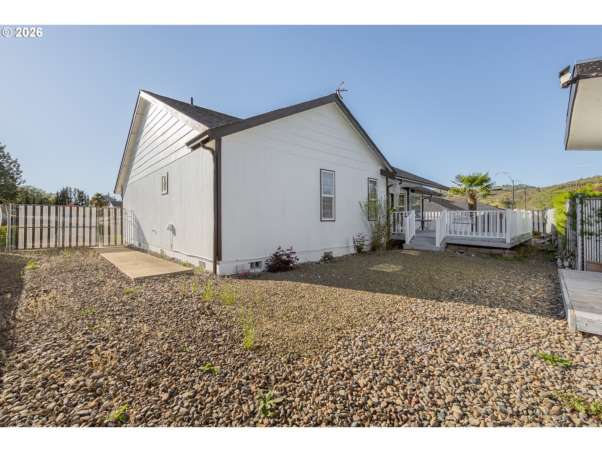 101 Pleasant Street Roseburg, OR 97470 - Photo 34 of 43 a view of a house with a backyard