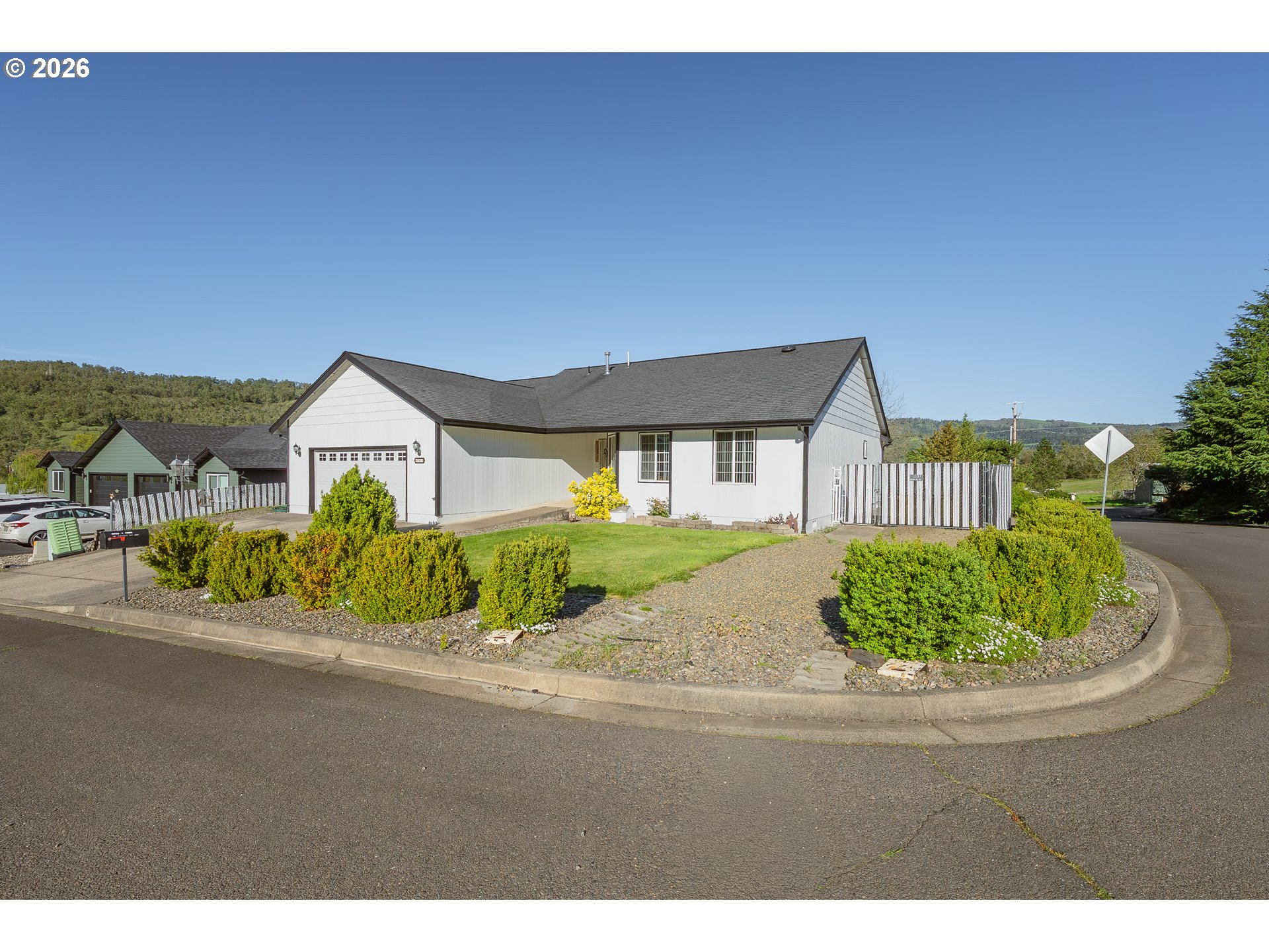 101 Pleasant Street Roseburg, OR 97470 - Photo 4 of 43 a front view of a house with a garden