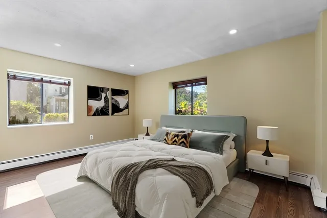 a bedroom with bed and window