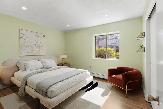 a bedroom with a bed and a couch