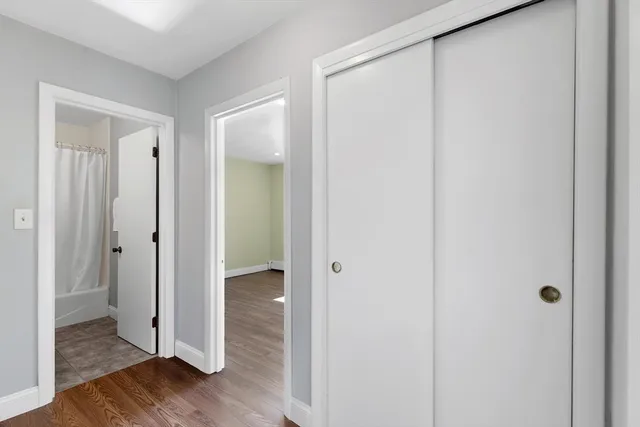 a view of a bathroom with wooden floor