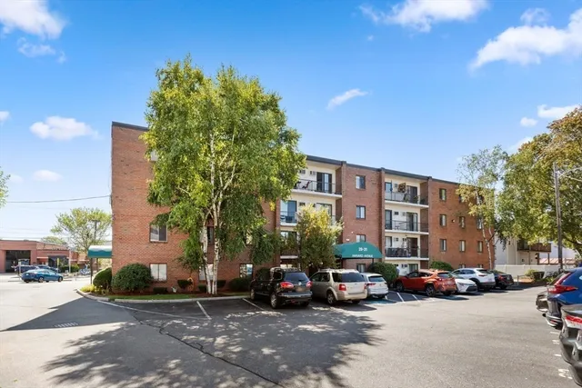 a view of a parked cars in front of a building