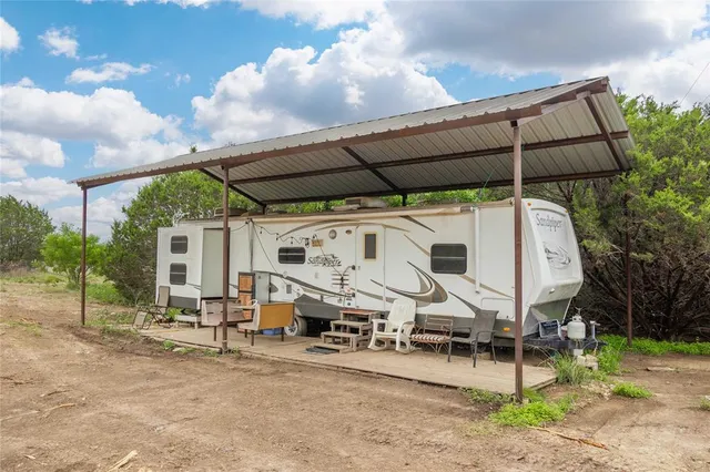 a wooden bench sitting in front of a house