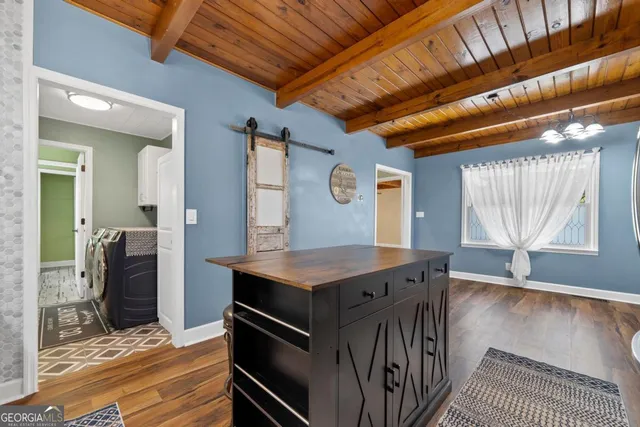 a view of a bathroom with racks on the wall and a shower