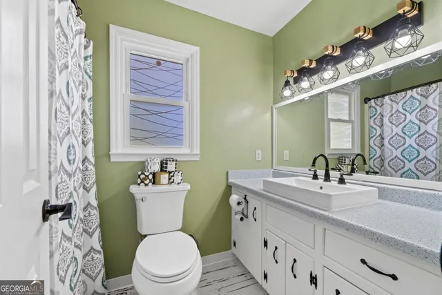 a view of a backyard with sitting area