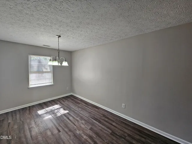 a room with window and wooden floor
