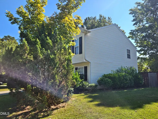 a house with a tree in front of it