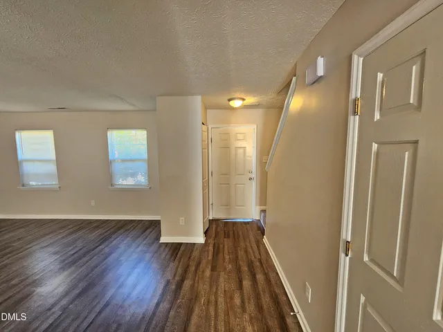 a view of entryway with wooden floor