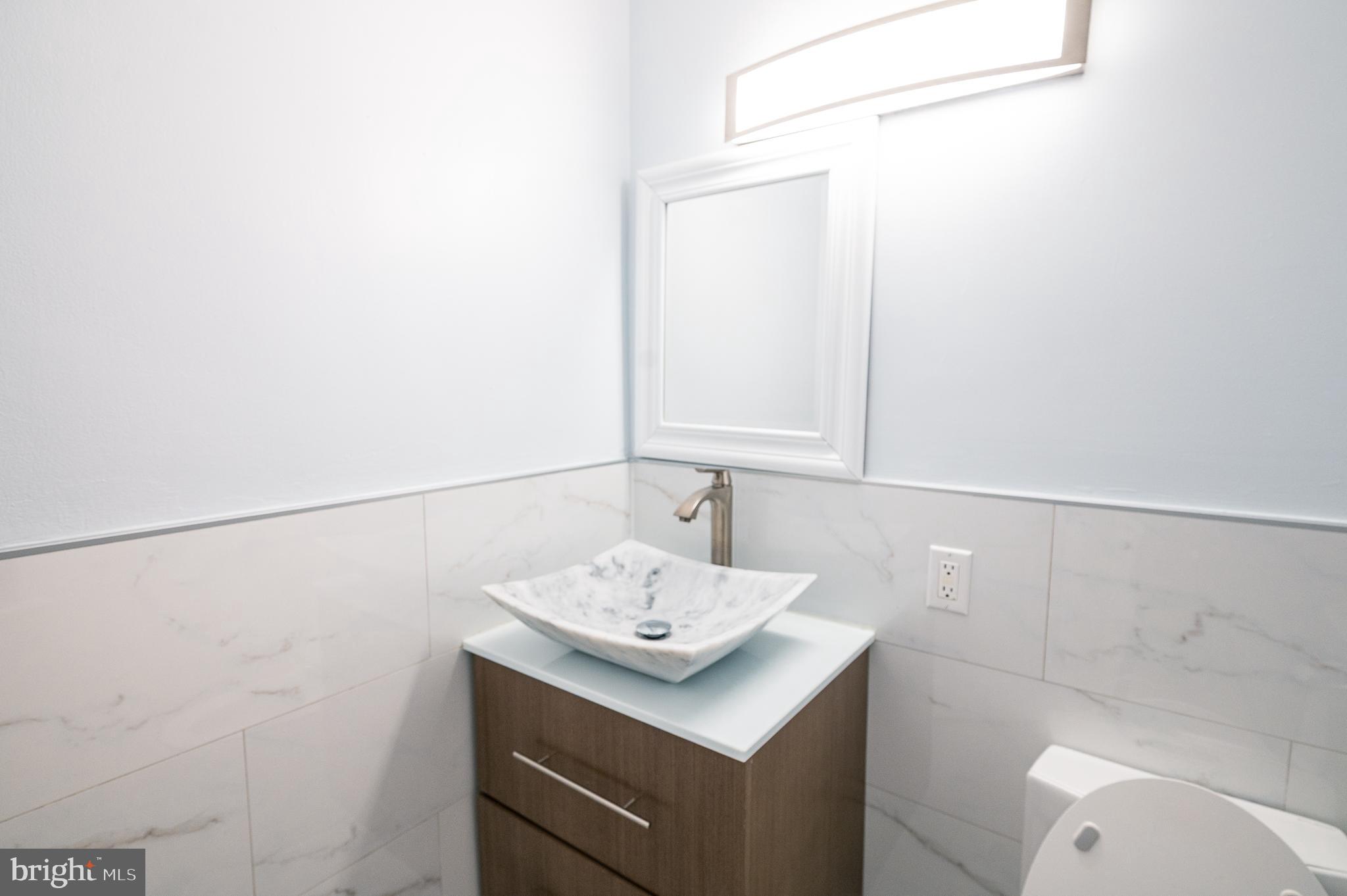 7722 Old York Road Elkins Park, PA 19027 - Photo 12 of 37 a bathroom with a sink and a mirror