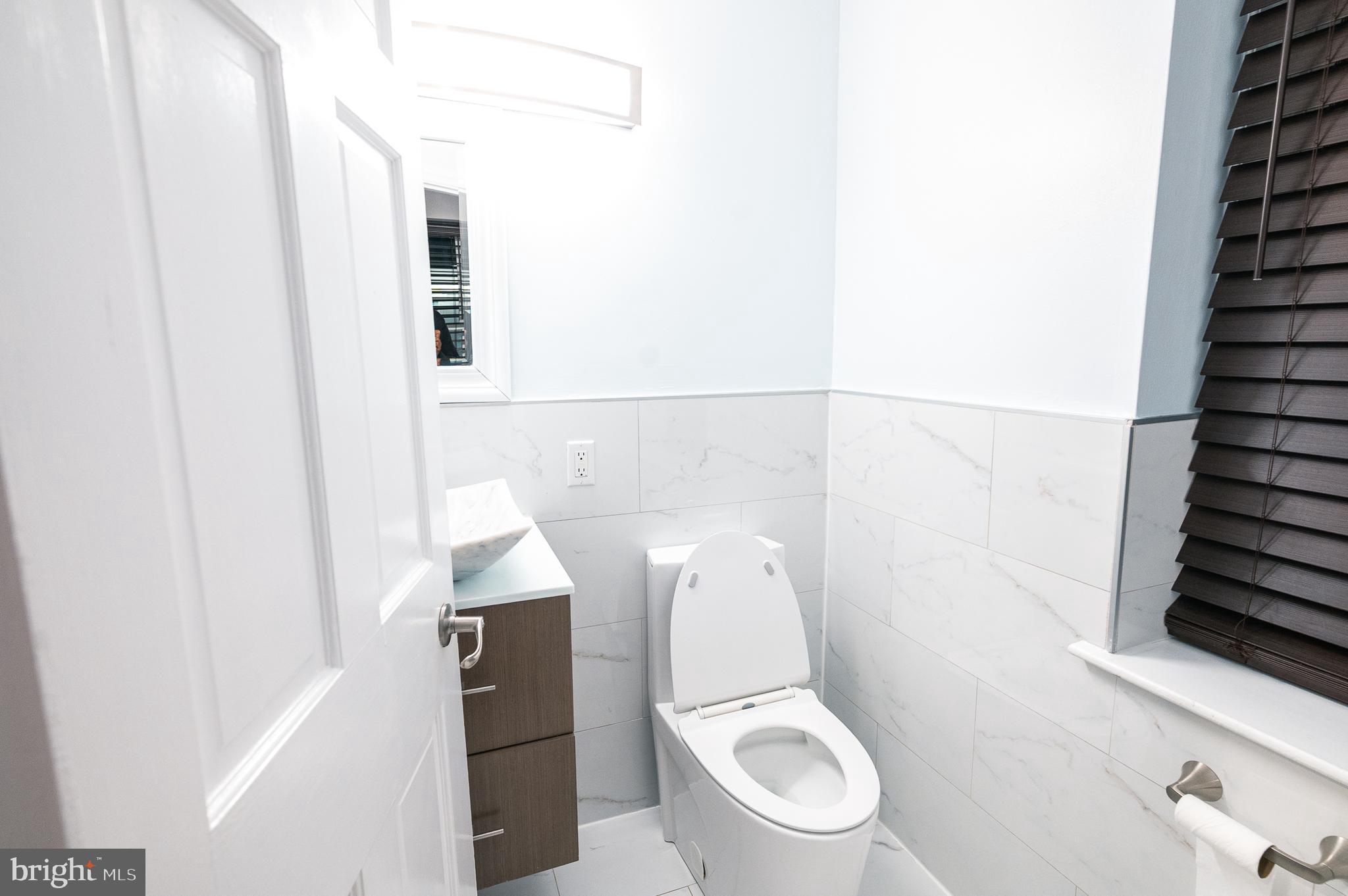 7722 Old York Road Elkins Park, PA 19027 - Photo 13 of 37 a white toilet sitting next to a shower