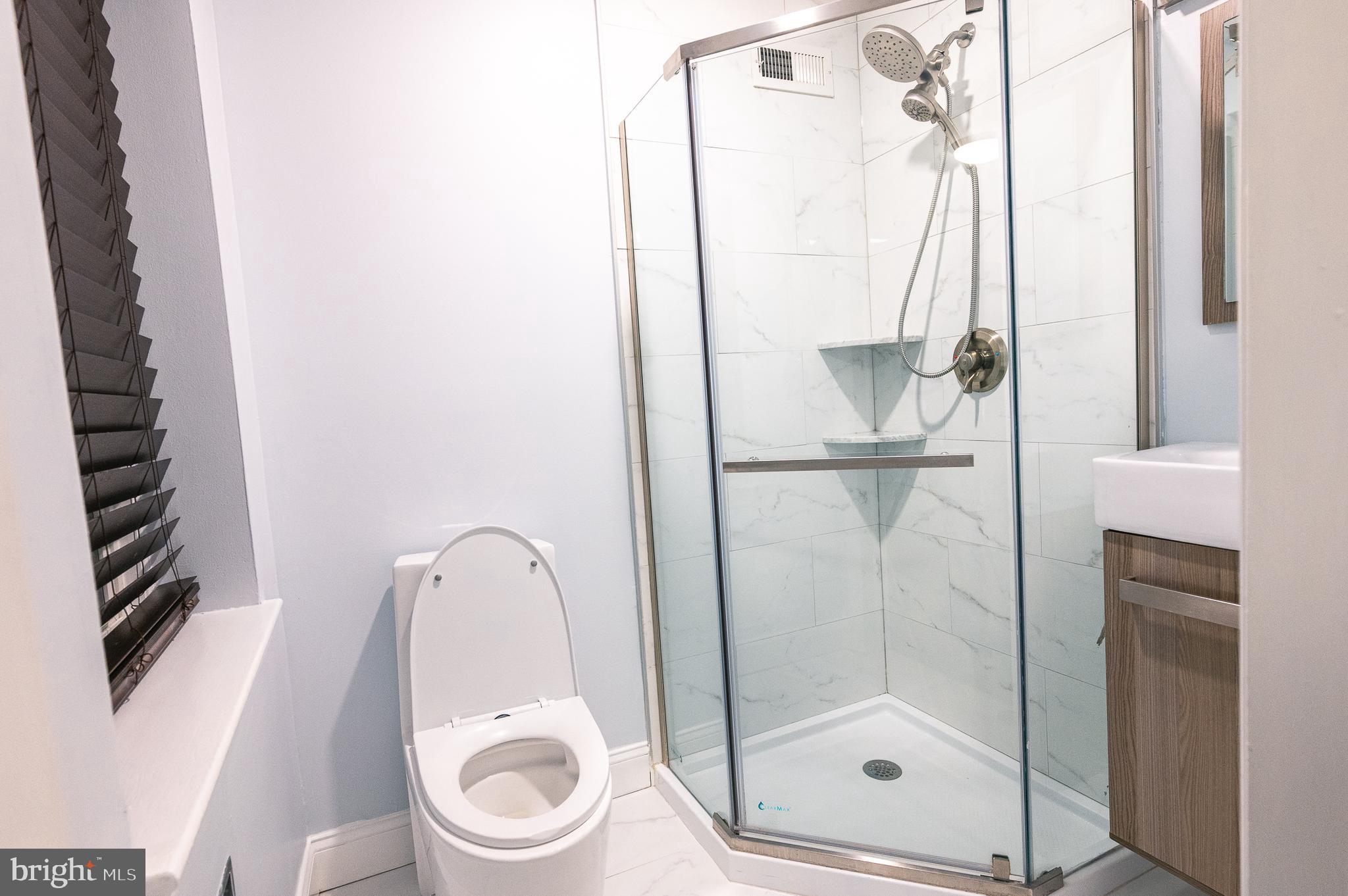7722 Old York Road Elkins Park, PA 19027 - Photo 16 of 37 a bathroom with a shower and toilet