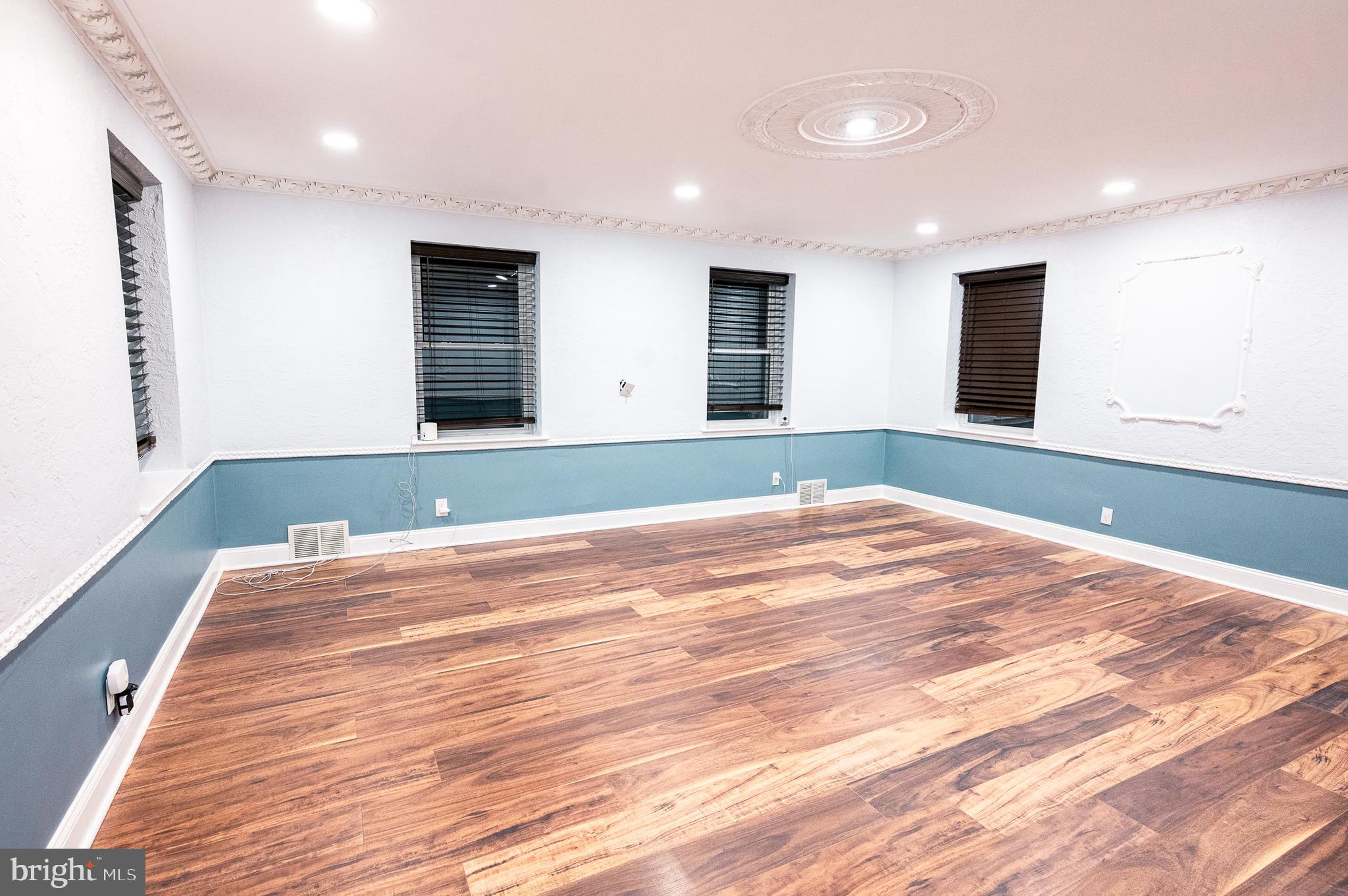 7722 Old York Road Elkins Park, PA 19027 - Photo 18 of 37 an empty room with wooden floor and windows
