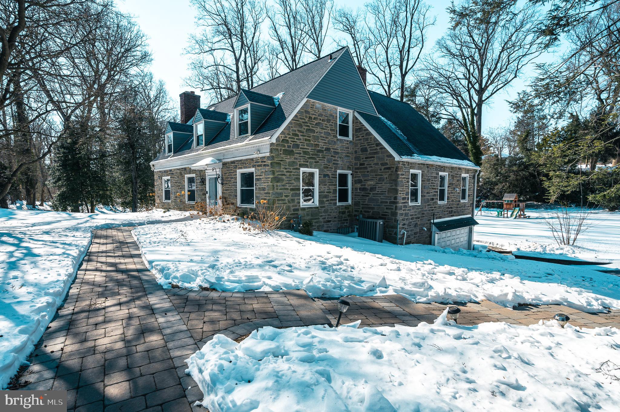 7722 Old York Road Elkins Park, PA 19027 - Photo 37 of 37 a front view of a house with a yard covered in snow