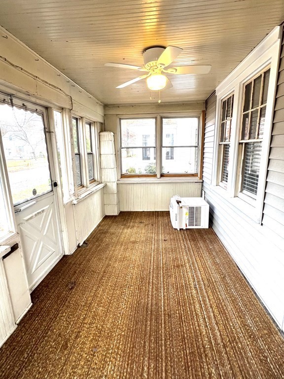 238 Edendale Street Springfield, MA 01104 - Photo 4 of 29 a view of an empty room with wooden floor and a window