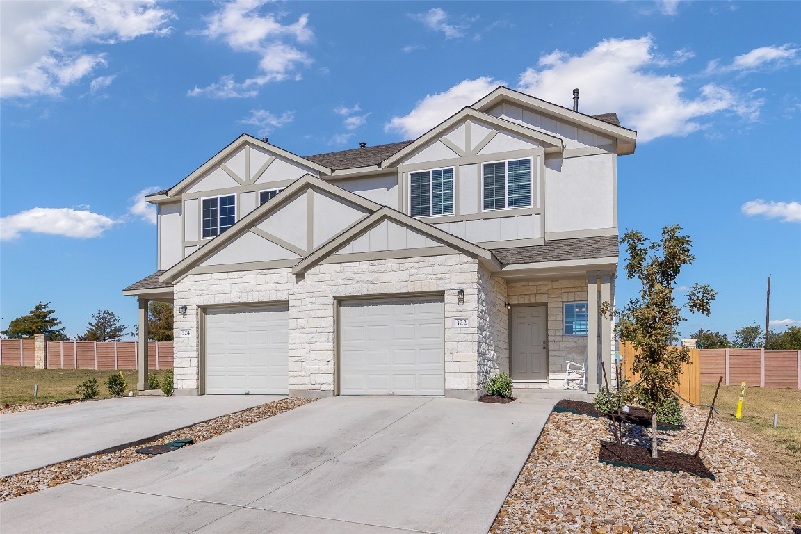 a view of a yard in front view of a house