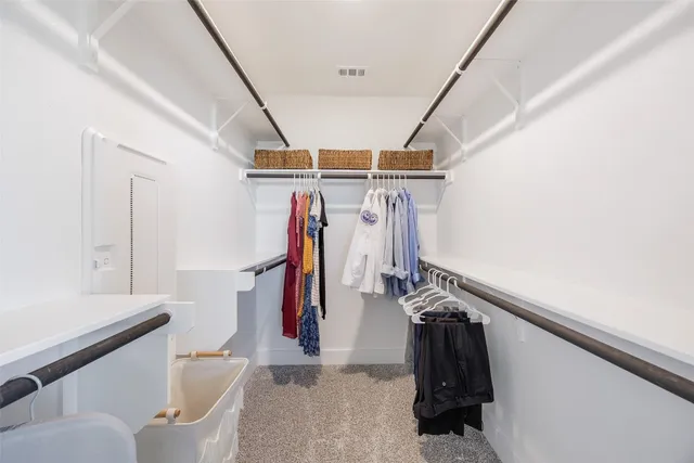 a bathroom with a shower and a sink