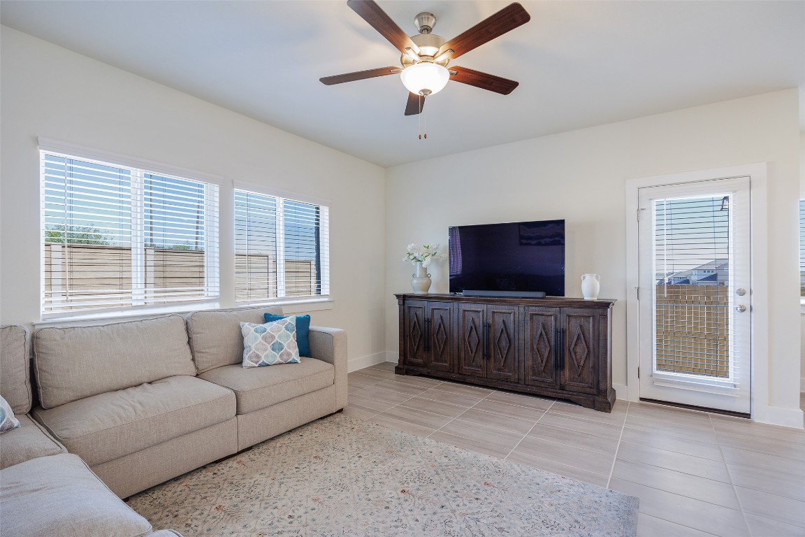 322 Furlong Drive Georgetown, TX 78626 - Photo 6 of 23 a living room with furniture and a flat screen tv