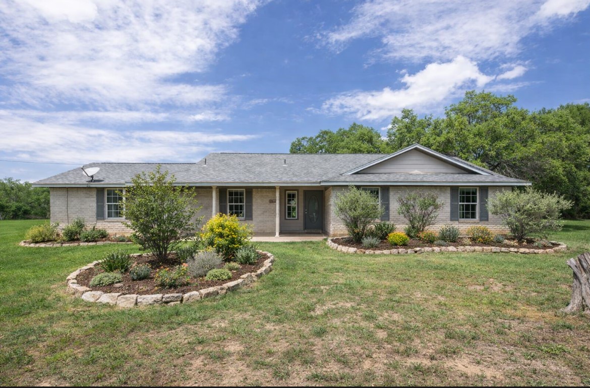 front view of a house with a yard