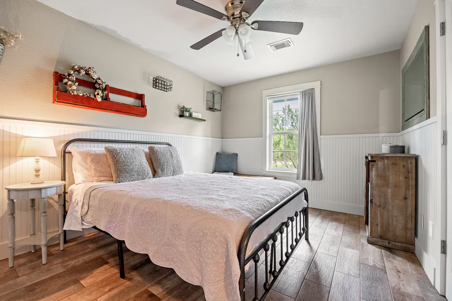 801 John Knox Road Fischer, TX 78623 - Photo 14 of 17 a bedroom with a bed and wooden floor