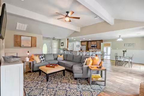 801 John Knox Road Fischer, TX 78623 - Photo 4 of 17 a living room with furniture a rug and a chandelier