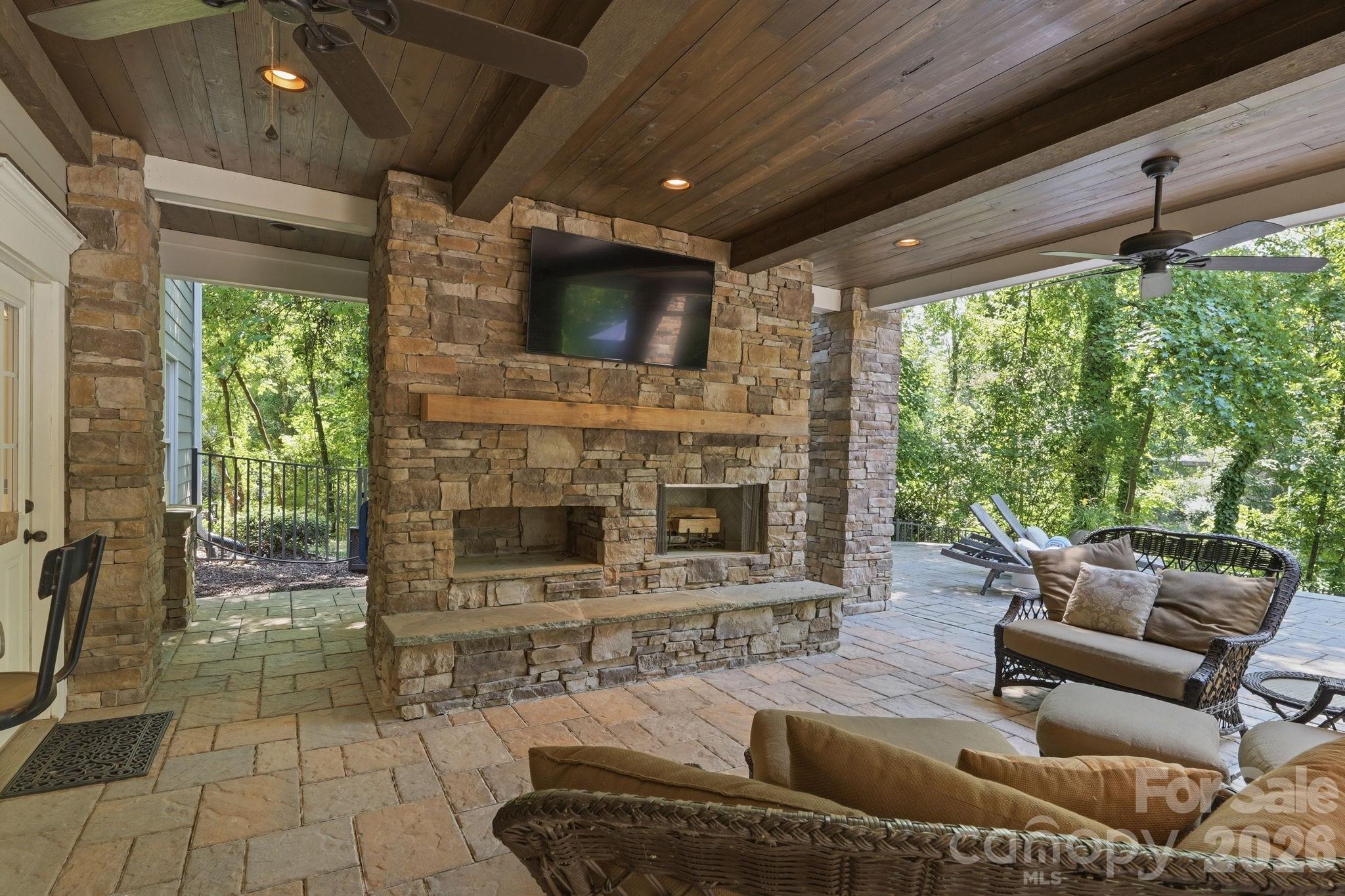 235 Grey Road Davidson, NC 28036 - Photo 35 of 42 a living room with furniture and a fireplace