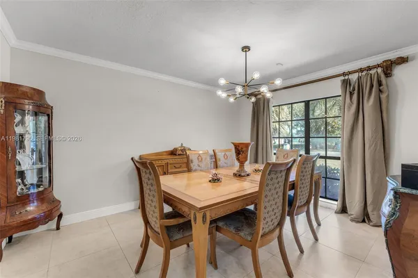 a view of a dining room with furniture and window