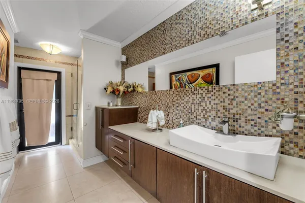 a bathroom with a sink a vanity and a mirror