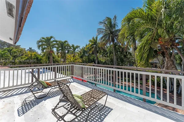 a view of a two chairs on the deck