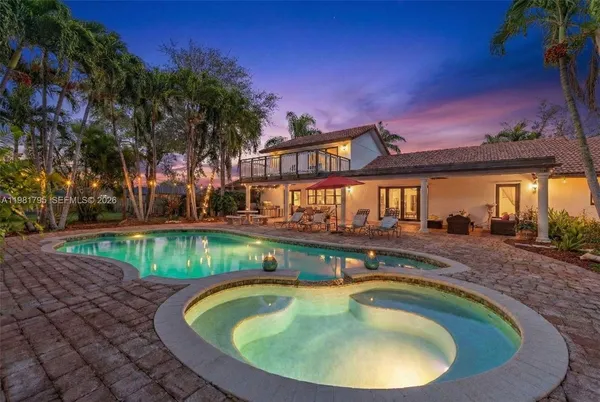 a view of swimming pool with outdoor seating