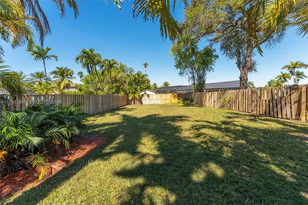 a view of yard with swimming pool