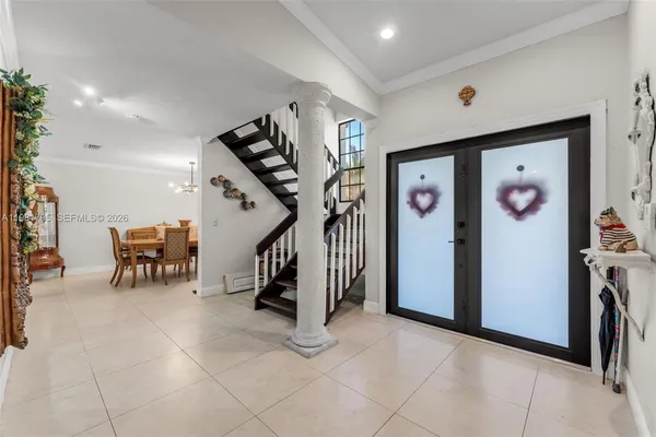 a view of entryway with livingroom and stairs