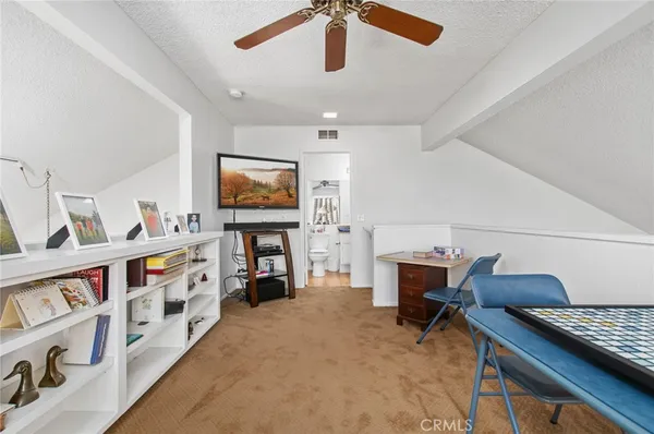 a bedroom with furniture and a fireplace