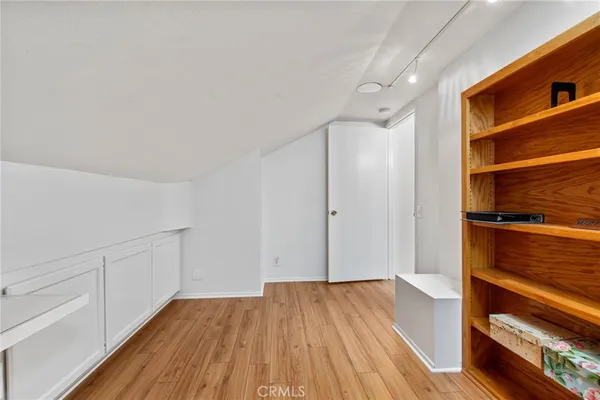 a view of hallway with wooden floor