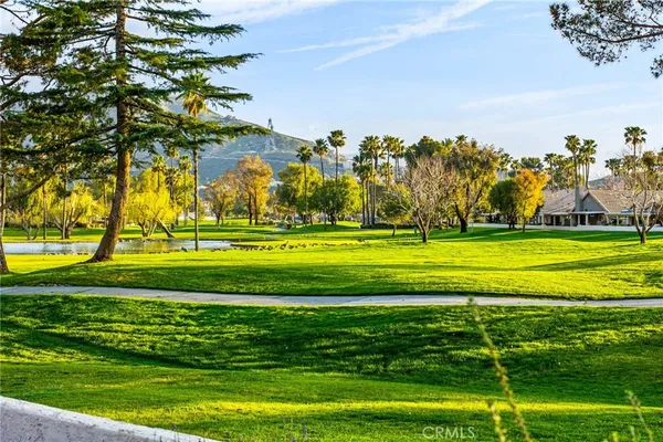 a view of swimming pool with an outdoor seating